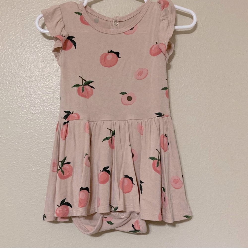 Kyte baby twirl bodysuit in peach
